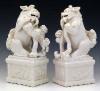 Lot 300 - Pair of Chinese white glazed lions of fo.