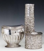 Lot 364 - Two silver caddies and a caster (3)