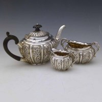 Lot 365 - Silver embossed bachelor's three piece tea set