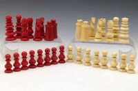 Lot 6 - Red and white ivory chess set, 19th century, in the manner of calvert.