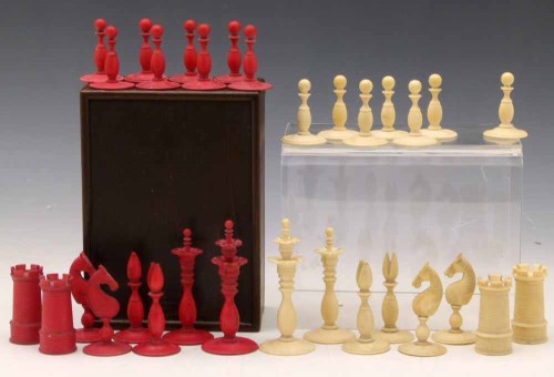 Lot 7 - Red and white ivory chess set (white pawn missing) in a calvert box.