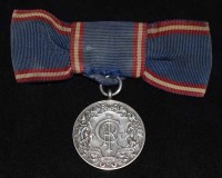 Lot 32 - Royal Victorian Medal, George VI, silver, with original ribbon.