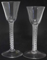Lot 59 - Two double air twist wine glasses.