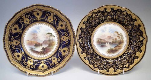 Lot 218 - Two Coalport plates signed P. Simpson, painted with Weir bridge Killarney, and Kilchurn Castle, with blue and gilt borders, (2) 26cm diameter     Cond