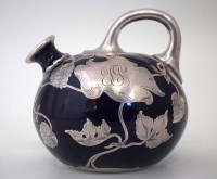 Lot 228 - Overlaid blue pottery ewer