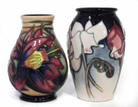 Lot 246 - Two boxed small Moorcroft vases.