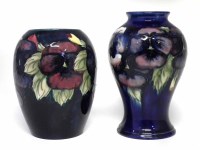 Lot 254 - Two Moorcroft vases, decorated with pansy pattern