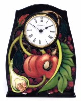 Lot 266 - Moorcroft clock, decorated with Queens choice