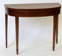 Lot 555 - George III fold-over table.