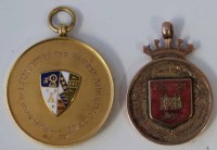 Lot 40 - Two 9ct athletics medals, one inscribed L. Bridgett by The Victoria Athletic Club 1921 and N.S.T.L. (1919-1920) Stoke NN, Len Bridgett.