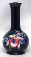 Lot 214 - Moorcroft lamp, decorated with orchid pattern on