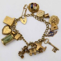Lot 308 - Gold charm bracelet.