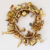 Lot 311 - 9ct gold charm bracelet
