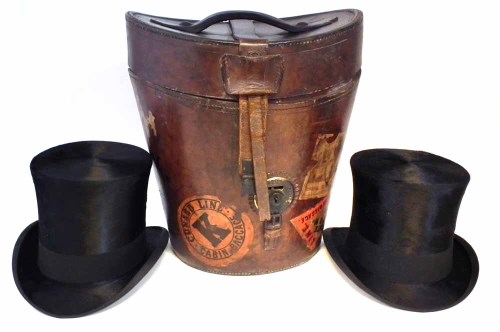 Lot 5 - Leather travel hat box containing two silk hats