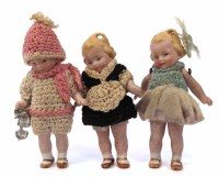 Lot 19 - Three dolls including skater.