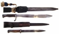 Lot 35 - Two Mauser bayonets in scabbards.