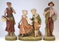 Lot 79 - Royal Dux figure group and a pair of figures.