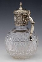 Lot 170 - Cut glass claret jug with silver top.