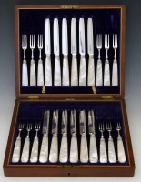Lot 171 - Cased set of silver fish knives and forks with mother-of-pearl handle in mahogany case.