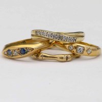 Lot 191 - Three 9ct gold diamond and gem set dress rings