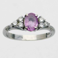 Lot 218 - 750 white gold ring set with an oval pink