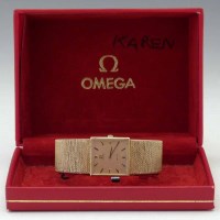 Lot 253 - Omega gold De Ville bracelet watch with square