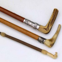 Lot 10 - Two bone handled crops; ivory headed cart whip