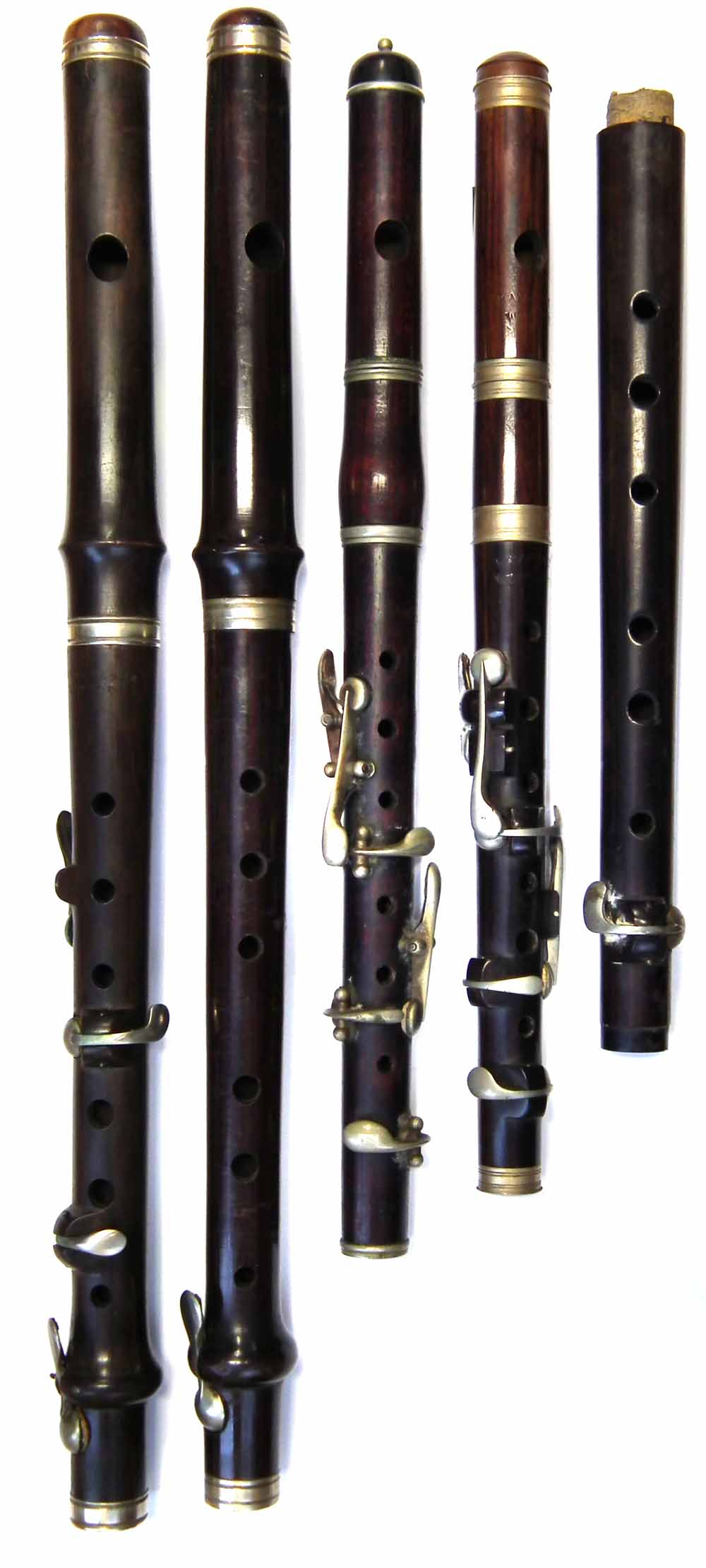 Lot 30 Three small flutes and a piccolo.