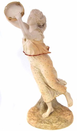 Lot 75 - Royal Worcester tambourine player.