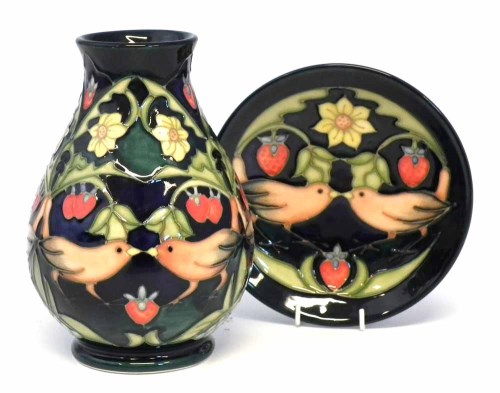 Lot 107 - Moorcroft vase and small dish, decorated with The