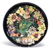 Lot 112 - Moorcroft charger, decorated with Carousel