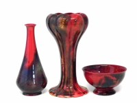 Lot 117 - Two Royal Doulton Sung flambe vases and a bowl.