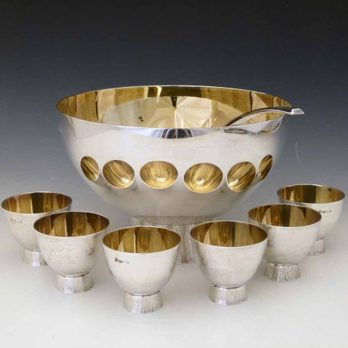Lot 165 - Punch bowl, six cups and a ladle.
