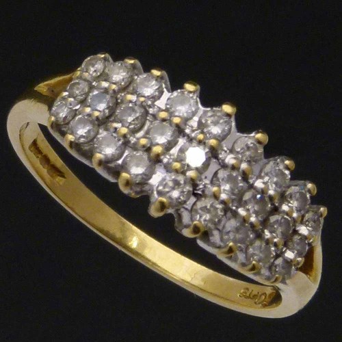 Lot 187 - Gold and diamond triple row cluster ring