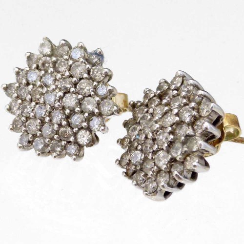 Lot 194 - Pair of diamond cluster earrings