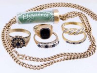 Lot 217 - Five dress rings and a £1 note on chain