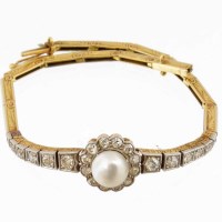 Lot 231 - Diamond and pearl bracelet.