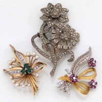 Lot 232 - Two gold brooches and a marcasite brooch