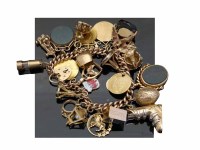 Lot 235 - Gold charm bracelet with three gold coins 123g