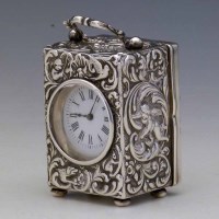 Lot 249 - Embossed silver carriage clock