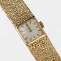 Lot 253 - Omega 9ct gold lady's bracelet watch, 33.1g.