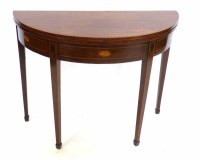 Lot 489 - George III mahogany semi-circular fold-over tea table