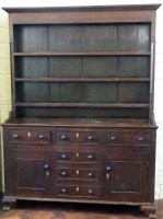Lot 497 - 18th century oak Anglesey dresser and rack.