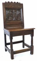 Lot 519 - 17th century oak back stool