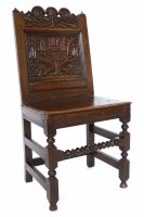 Lot 523 - 17th century oak back stool