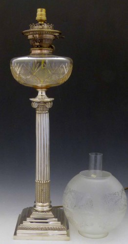 Lot 24 - Silver plated oil lamp with column stem.