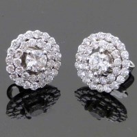 Lot 297 - Pave diamond cluster earrings in white gold