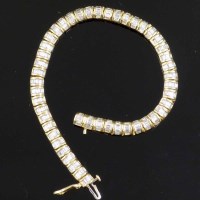 Lot 302 - 18ct gold bracelet set with baguette diamonds