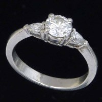 Lot 325 - 950 platinum and diamond three-stone ring