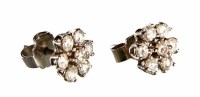 Lot 256 - Pair of 18ct white gold diamond flower head cluster earrings
